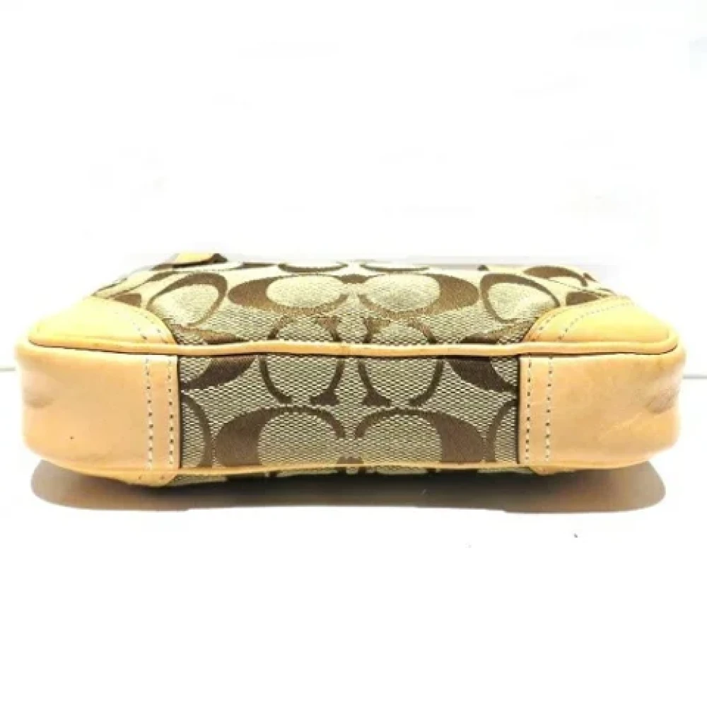 Coach Pre-owned Canvas clutches Brown Dames