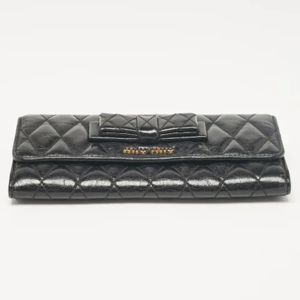Miu Pre-owned Leather wallets Black Dames