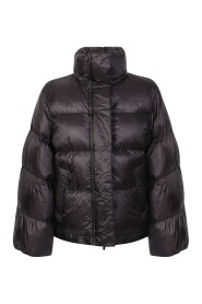 Down jacket with wide sleeve detail by Sacai. The brand has been described as influential in breaking down the dichotomy between casual and formal wear.
