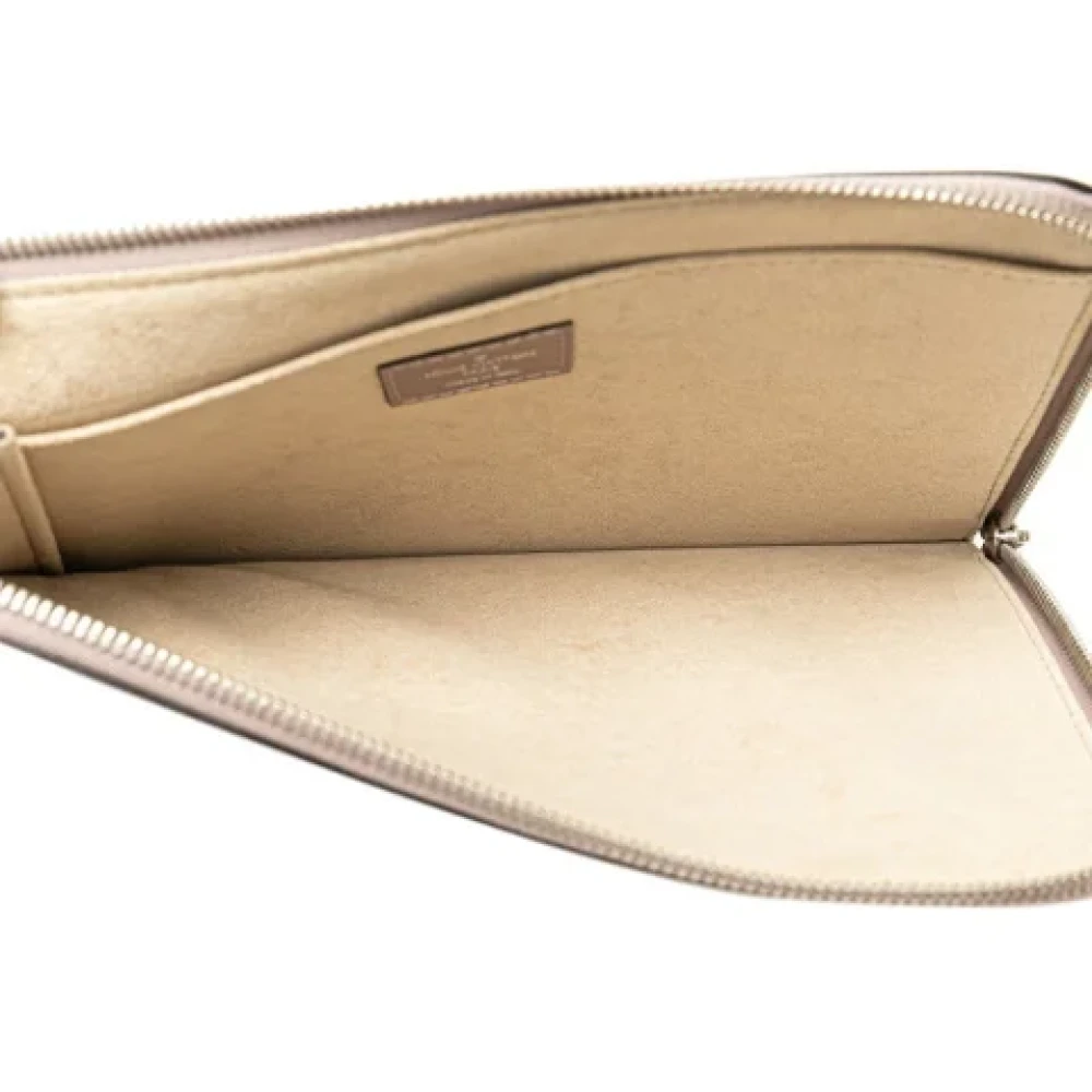 Louis Vuitton Vintage Pre-owned Leather clutches Beige Dames