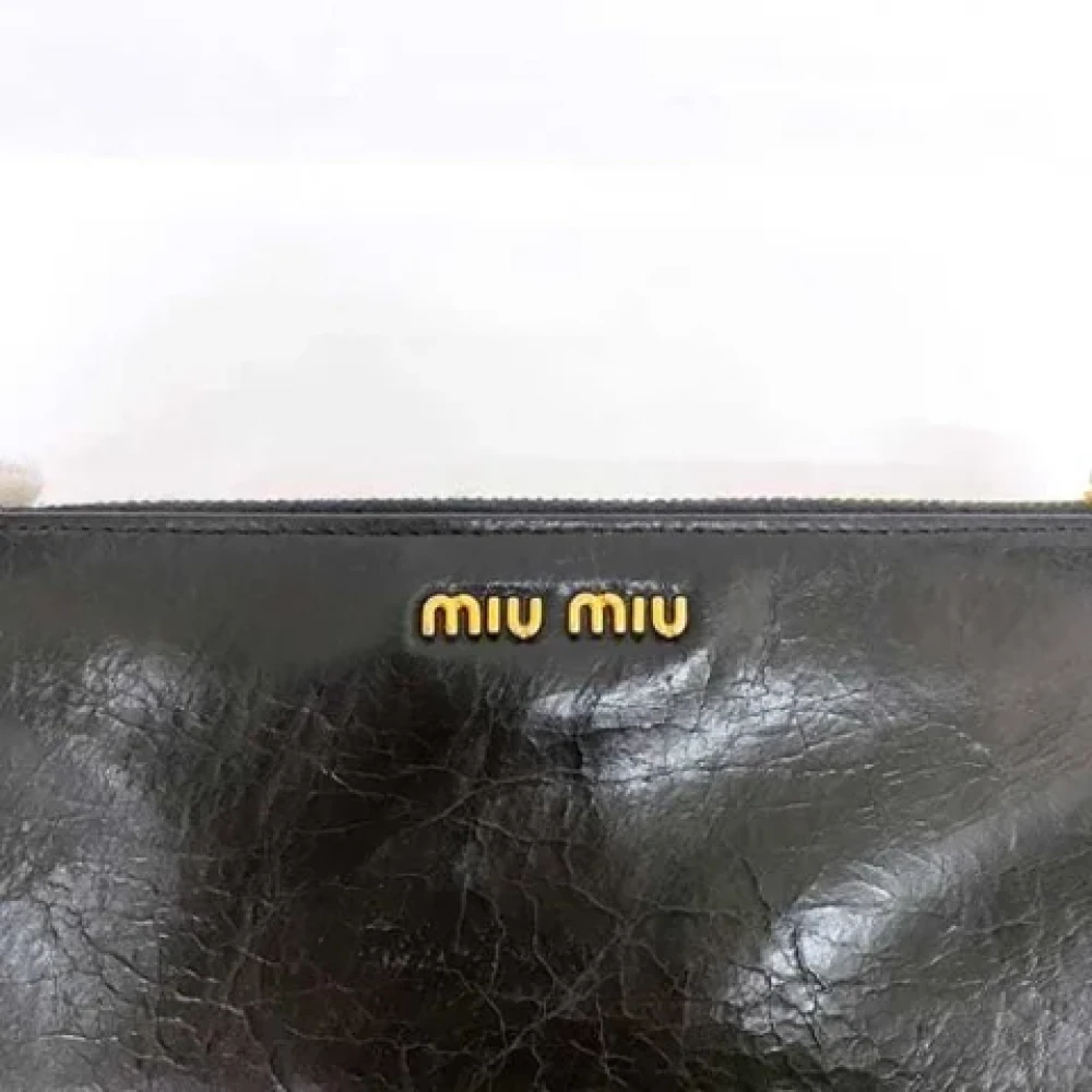 Miu Pre-owned Leather wallets Black Dames