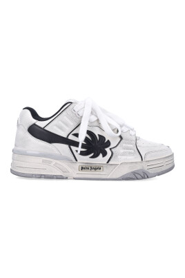 worn-out-sneakers-with-elongated-palm-tree