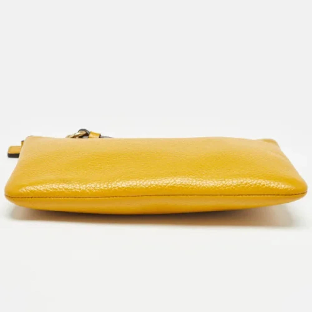 Coach Pre-owned Leather clutches Yellow Dames