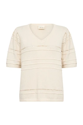 Stickad blus med broderade detaljer