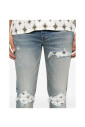 light-blue-ripped-jeans-with-button-fly