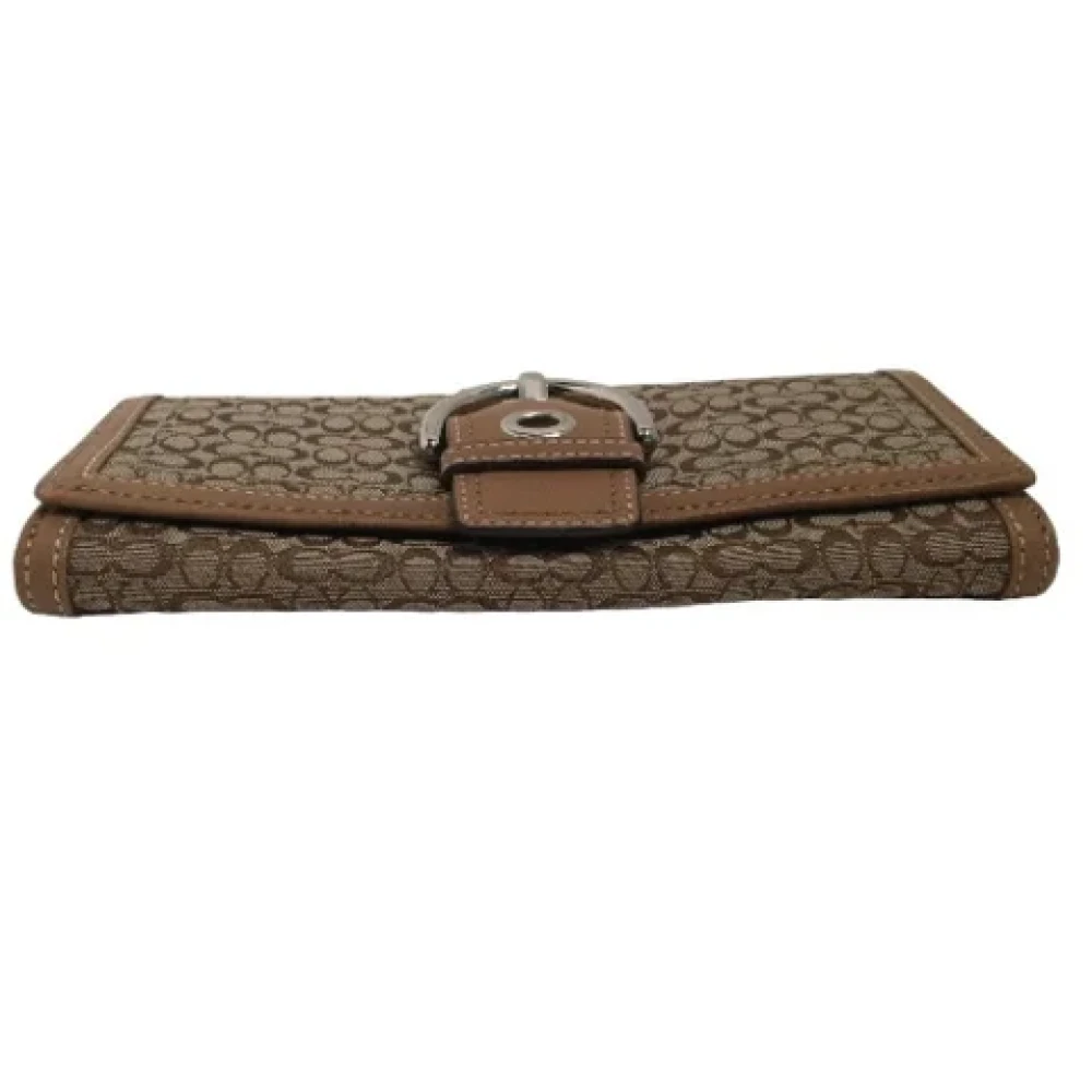 Coach Pre-owned Fabric clutches Brown Dames