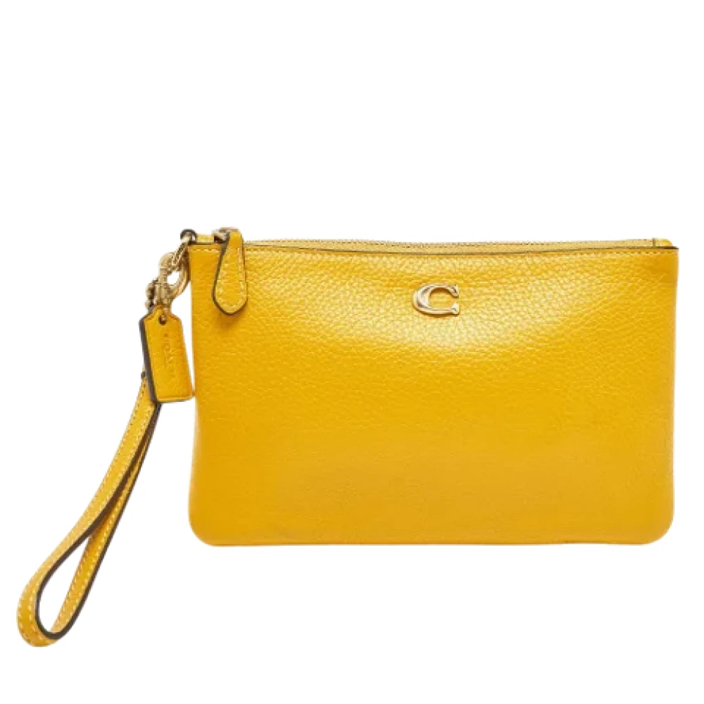 Coach Pre-owned Leather clutches Yellow Dames