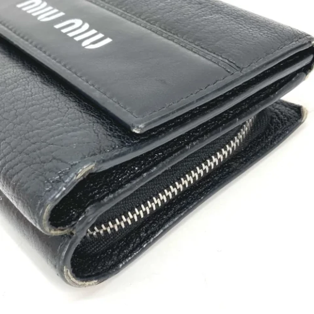 Miu Pre-owned Leather wallets Black Dames