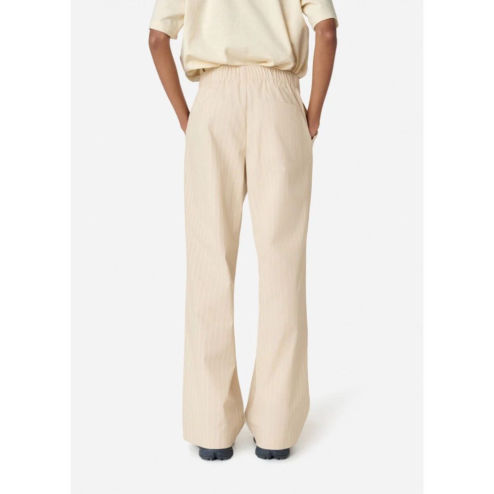 Axel Arigato Gestreepte katoenen broek Beige Dames