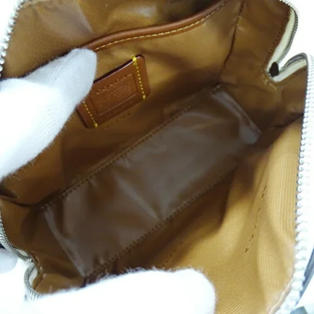Coach Pre-owned Leather clutches Beige Dames