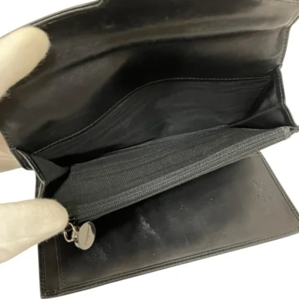 Salvatore Ferragamo Pre-owned Leather wallets Black Unisex