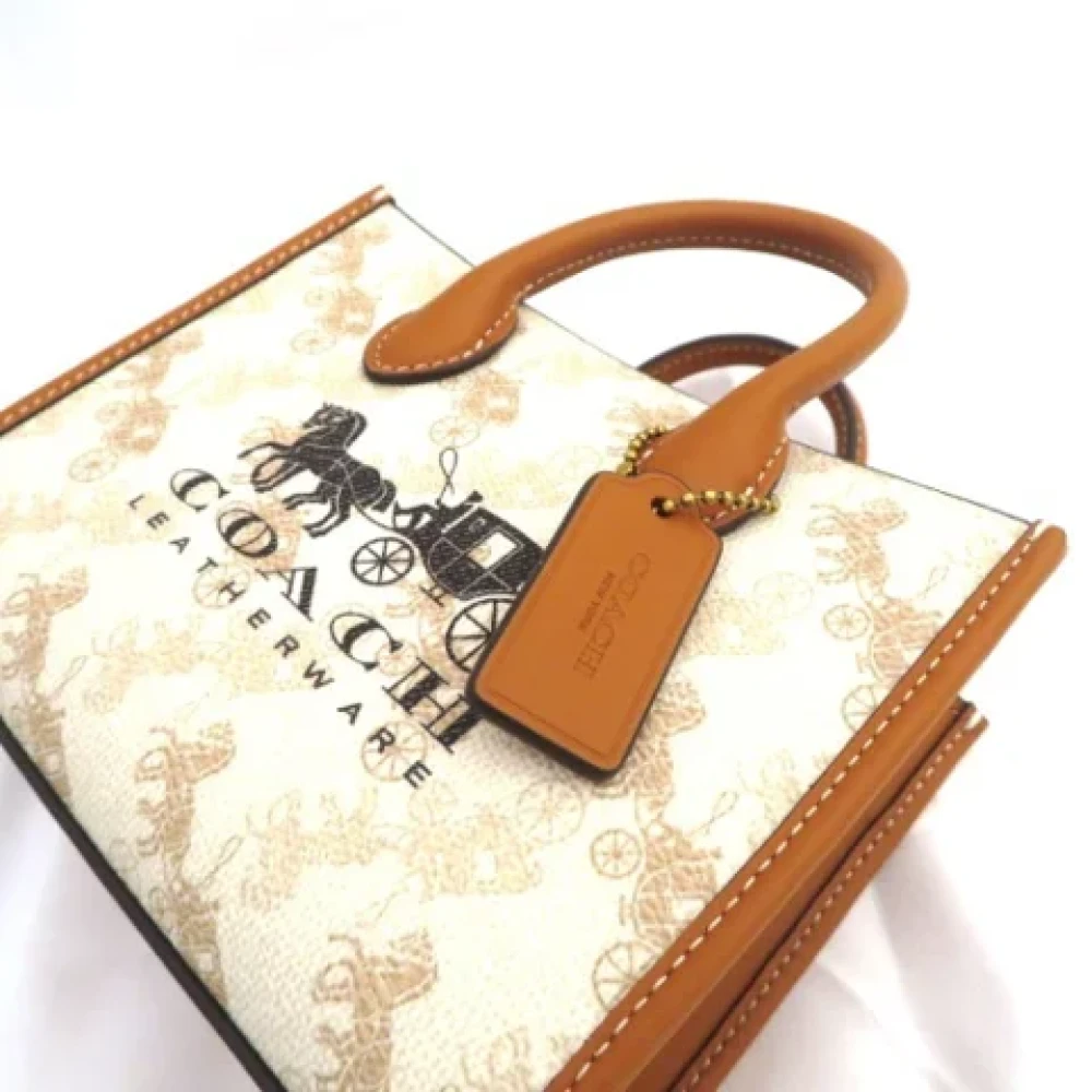 Coach Pre-owned Plastic handbags Beige Dames