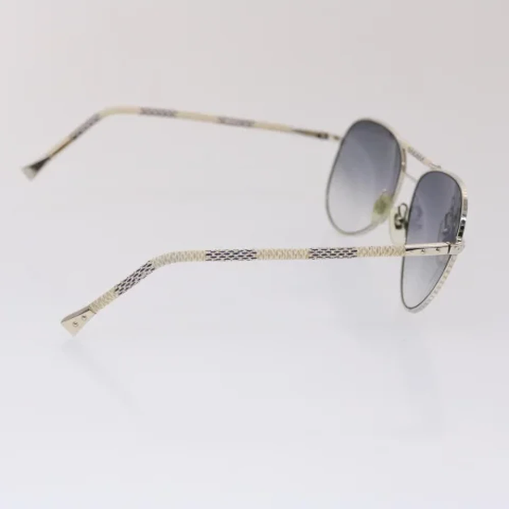 Louis Vuitton Vintage Pre-owned Metal sunglasses Gray Dames