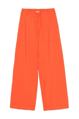 orange-dragsko-byxor-med-fickor