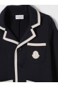 blazer-en-tricot-bleu-avec-piping