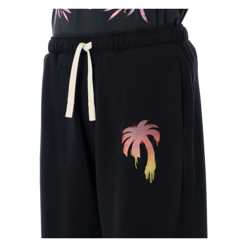 Palm Angels Zwarte losse sweatpants met spray palmboom grafisch Black Heren