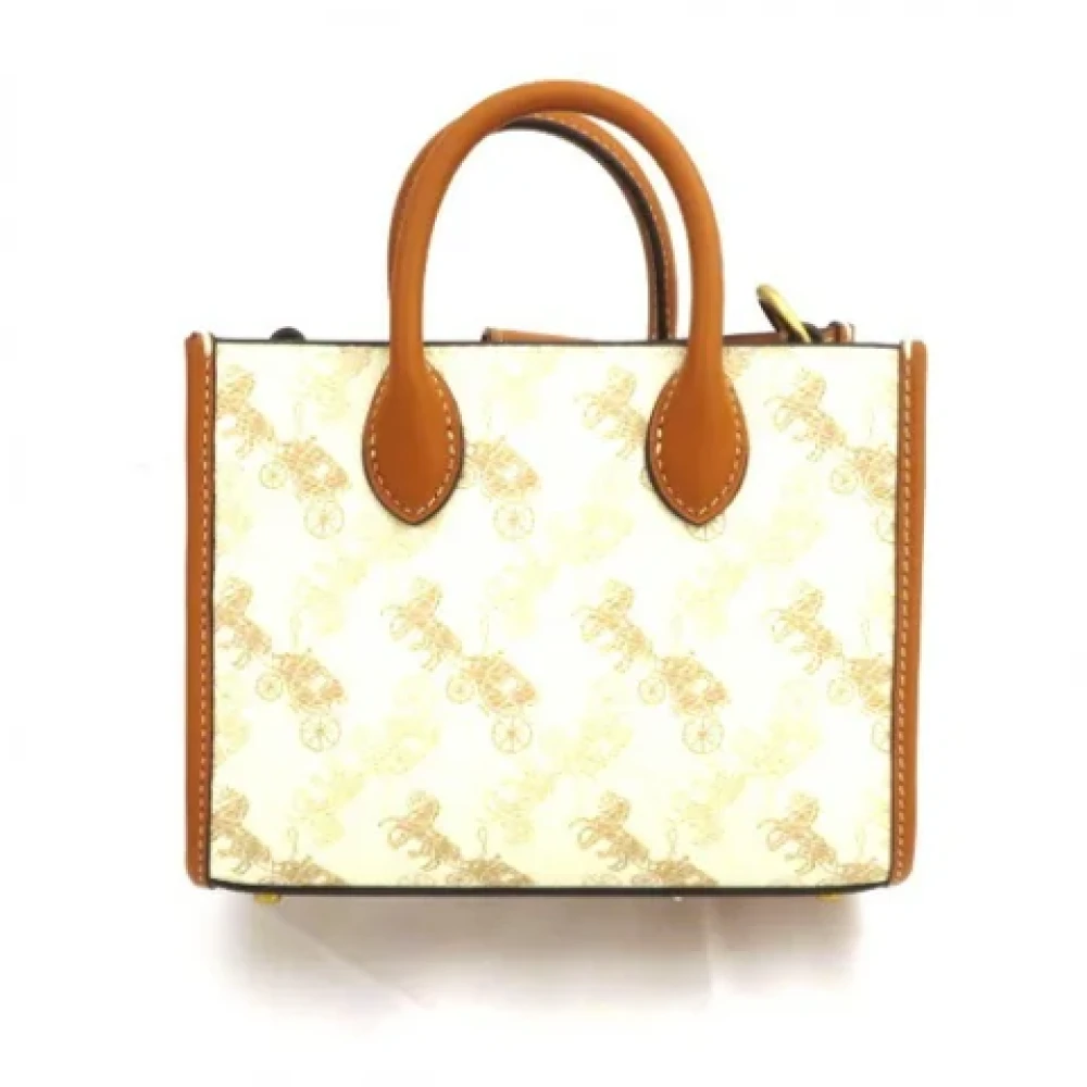 Coach Pre-owned Plastic handbags Beige Dames