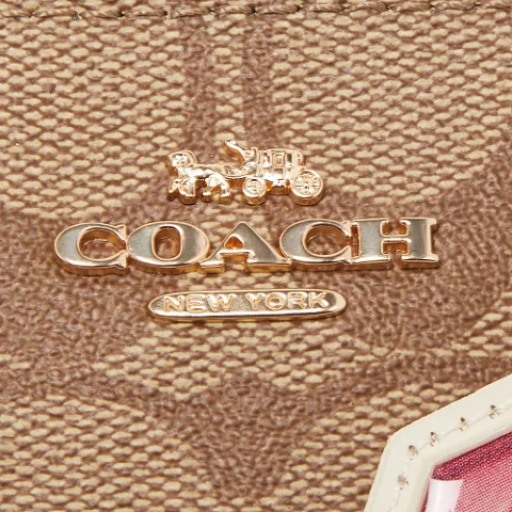 Coach Pre-owned Coated canvas pouches Beige Dames