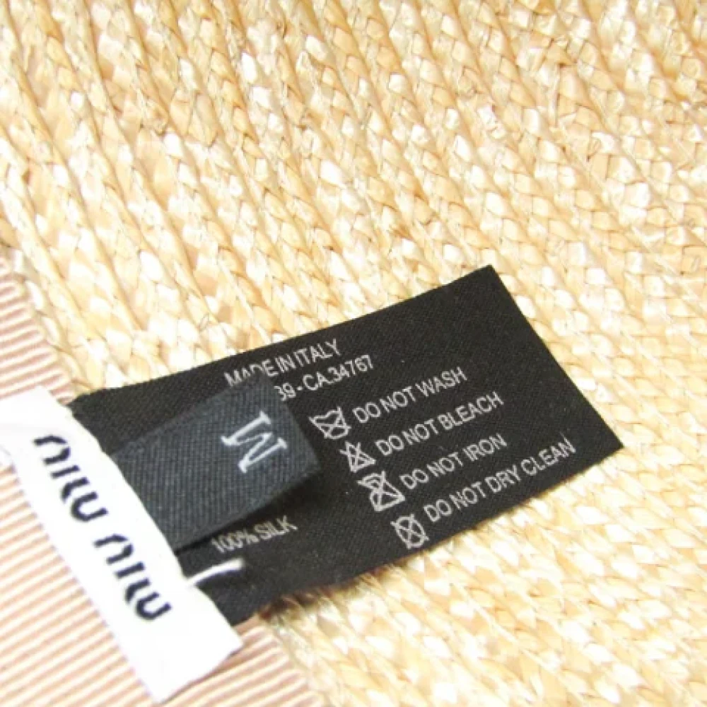 Miu Pre-owned Fabric hats Beige Dames