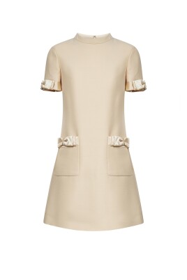 flared-beige-dress-with-satin-bows
