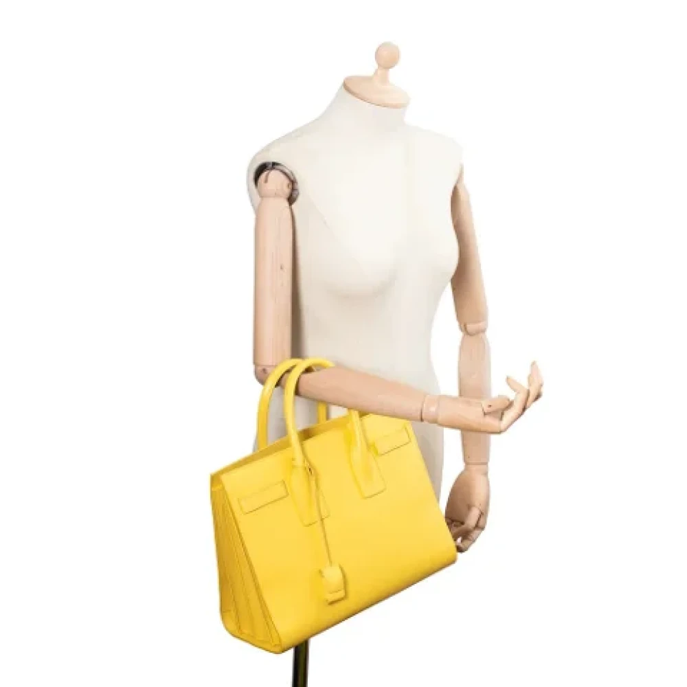 Yves Saint Laurent Vintage Pre-owned Leather handbags Yellow Dames