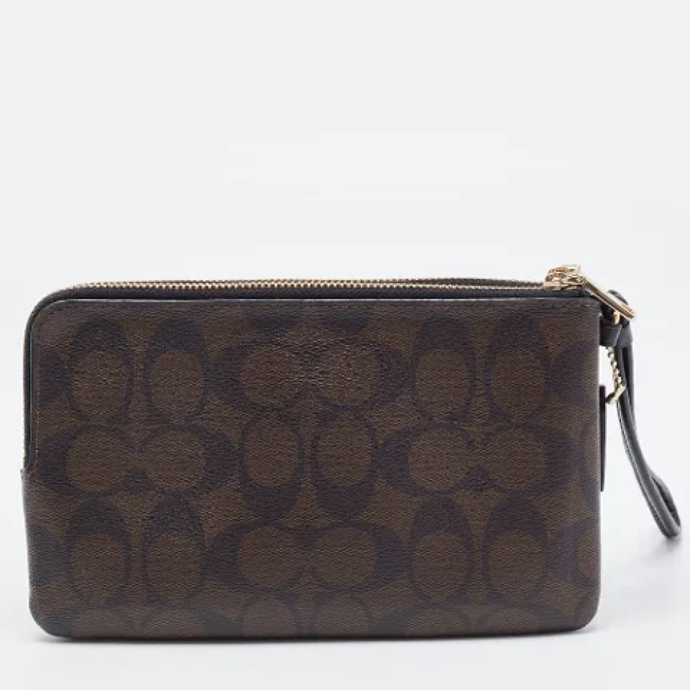 Coach Pre-owned Coated canvas clutches Brown Dames