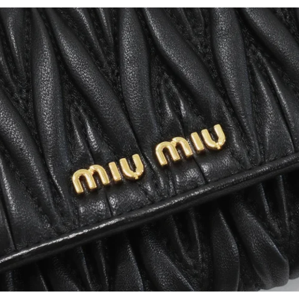 Miu Pre-owned Leather wallets Black Dames