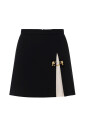mini-jupe-chic-bicolore-avec-detail-dore