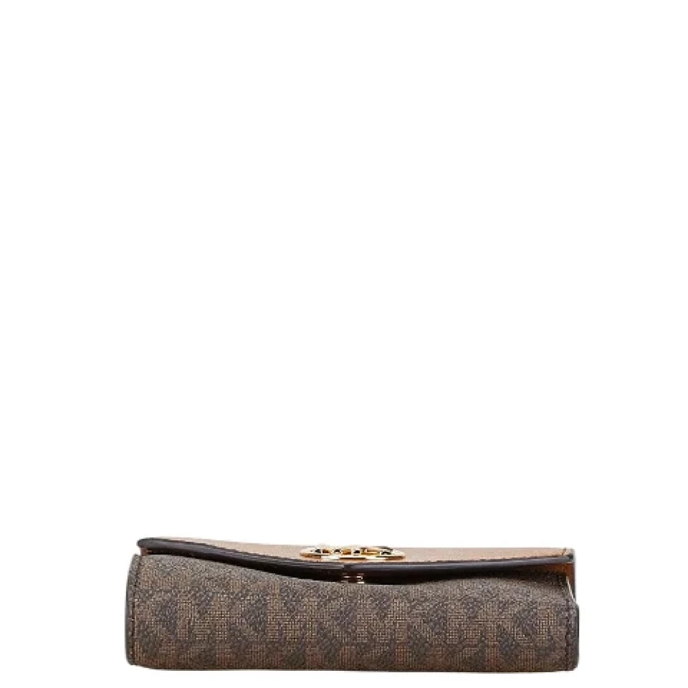 Michael Kors Pre-owned Canvas wallets Brown Dames