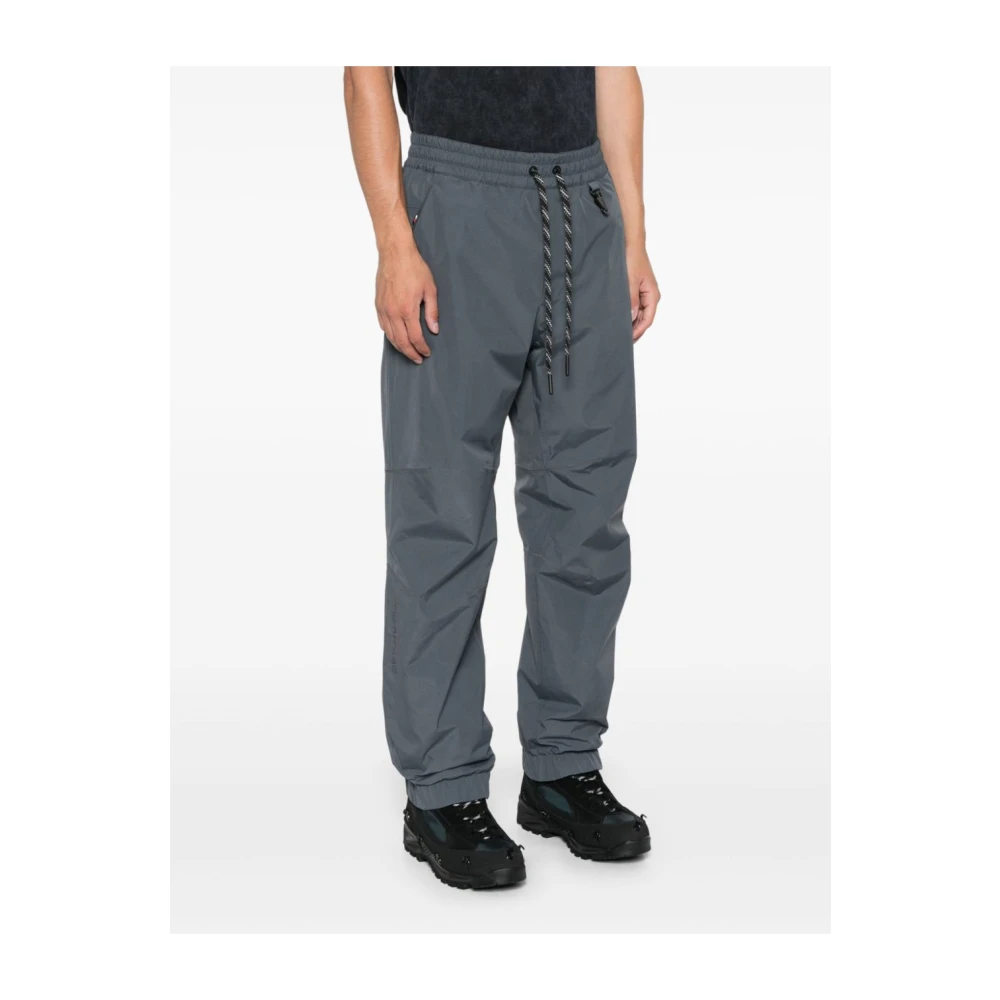 Moncler Grijze gewatteerde broek met reflecterende details Gray Heren