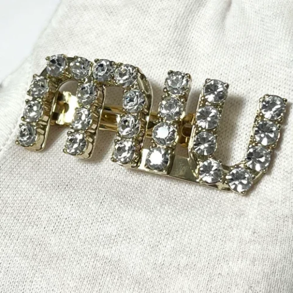 Miu Pre-owned Metal hair-accessories Yellow Dames