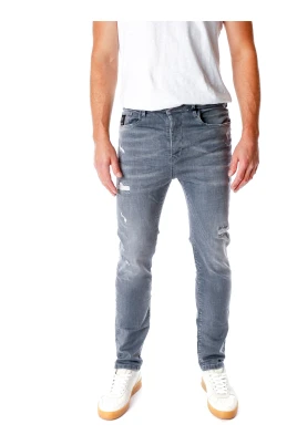 Avslappnad passform midjehöga jeans med slitna detaljer