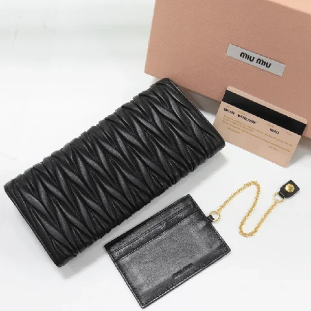 Miu Pre-owned Leather wallets Black Dames