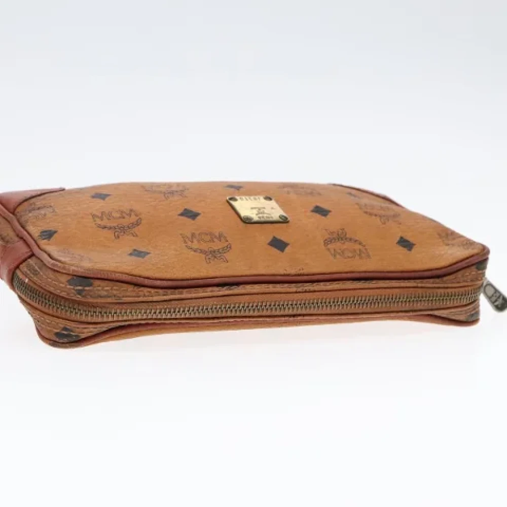 MCM Pre-owned Leather clutches Brown Dames