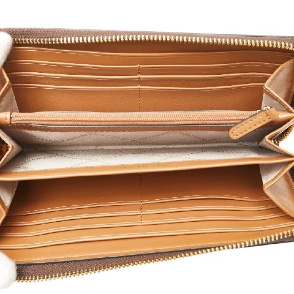 Michael Kors Pre-owned Canvas wallets Brown Dames