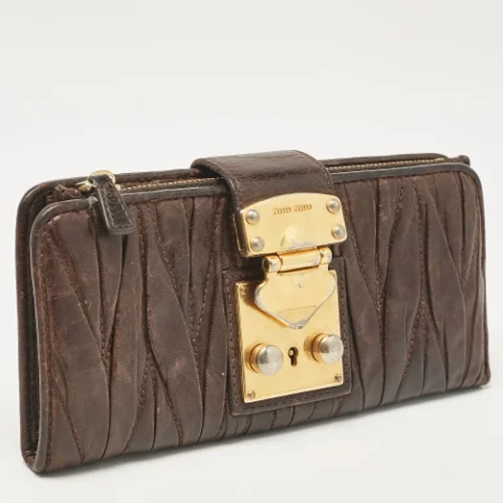 Miu Pre-owned Leather wallets Brown Dames