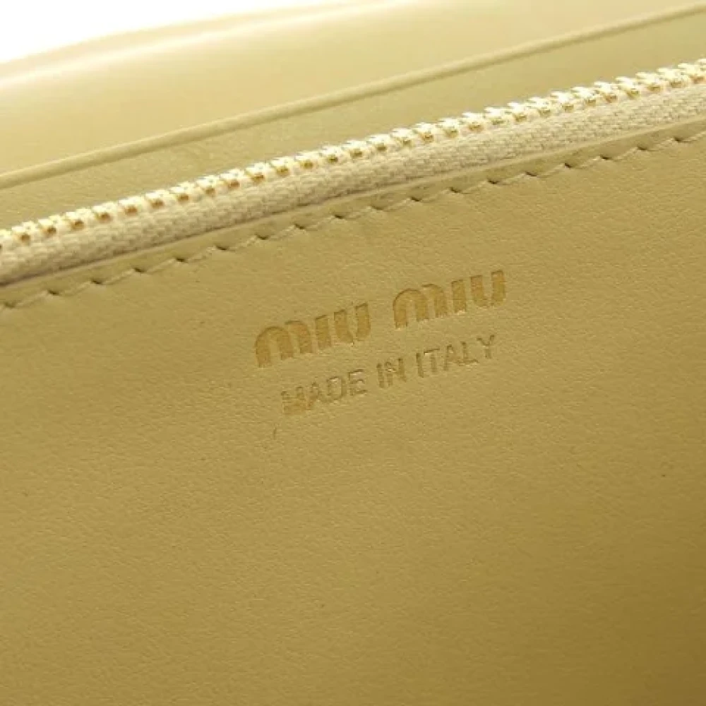 Miu Pre-owned Leather wallets Yellow Dames
