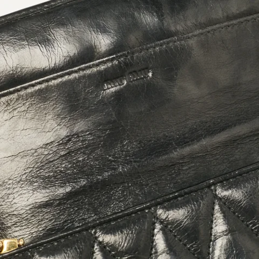 Miu Pre-owned Leather wallets Black Dames
