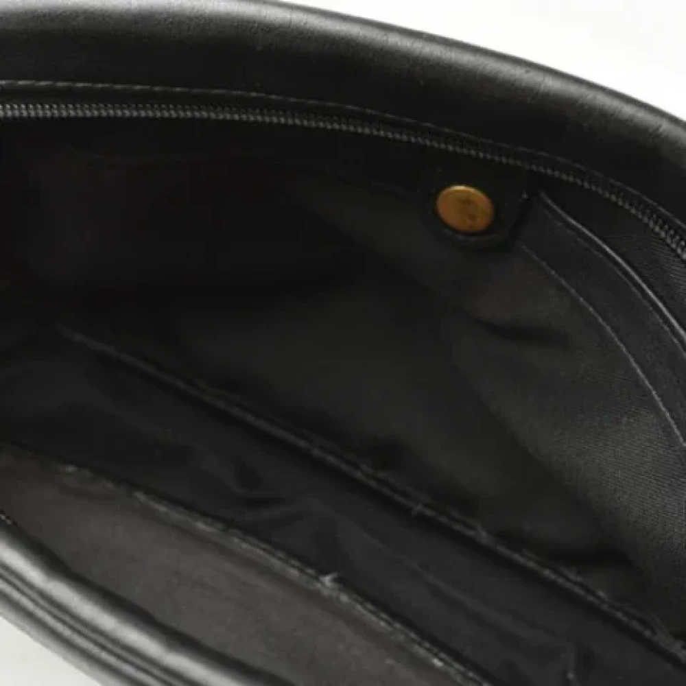 Coach Pre-owned Leather clutches Black Dames