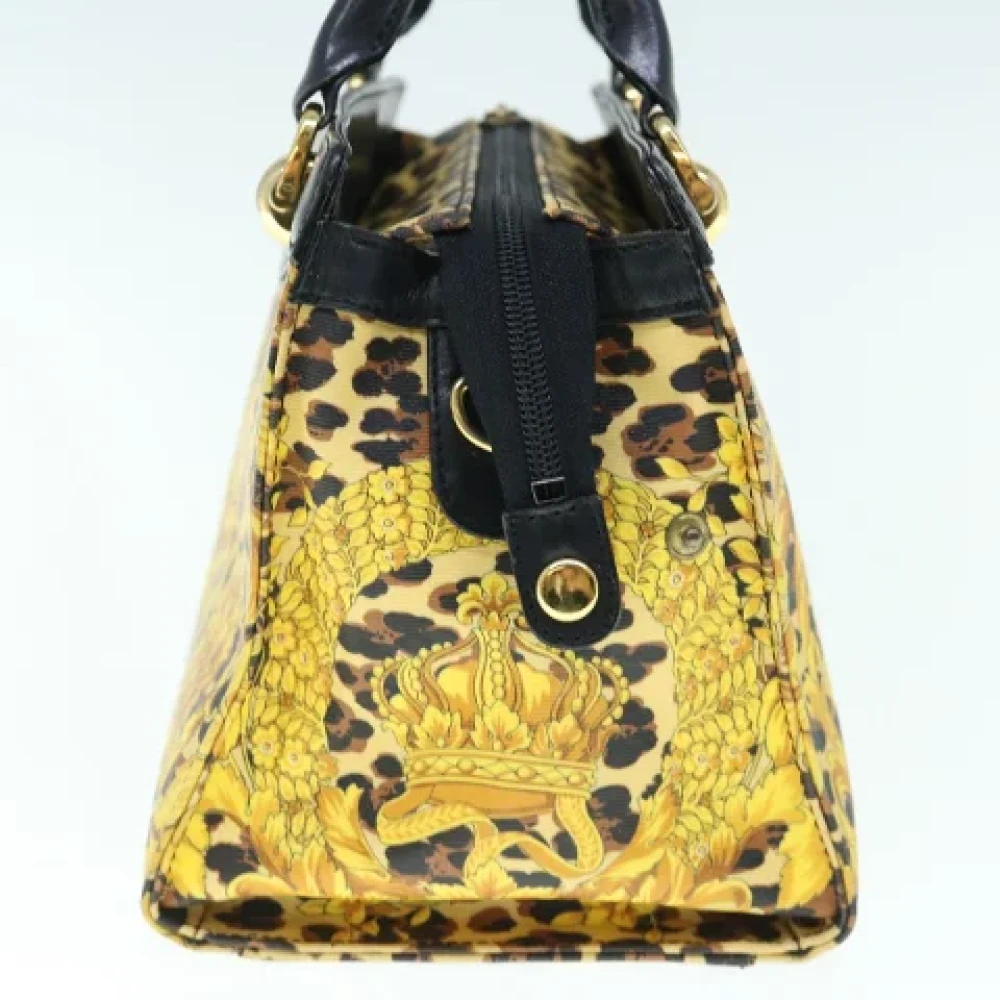 Versace Pre-owned Canvas handbags Yellow Dames