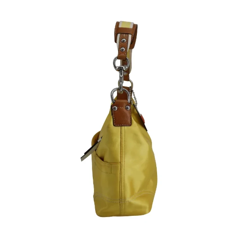 Coach Pre-owned Polyester handbags Yellow Dames