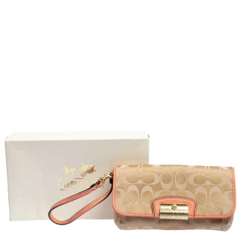Coach Pre-owned Canvas clutches Beige Dames