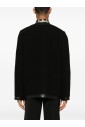 veste-minimaliste-en-tweed-boucle-avec-finitions-en-cuir
