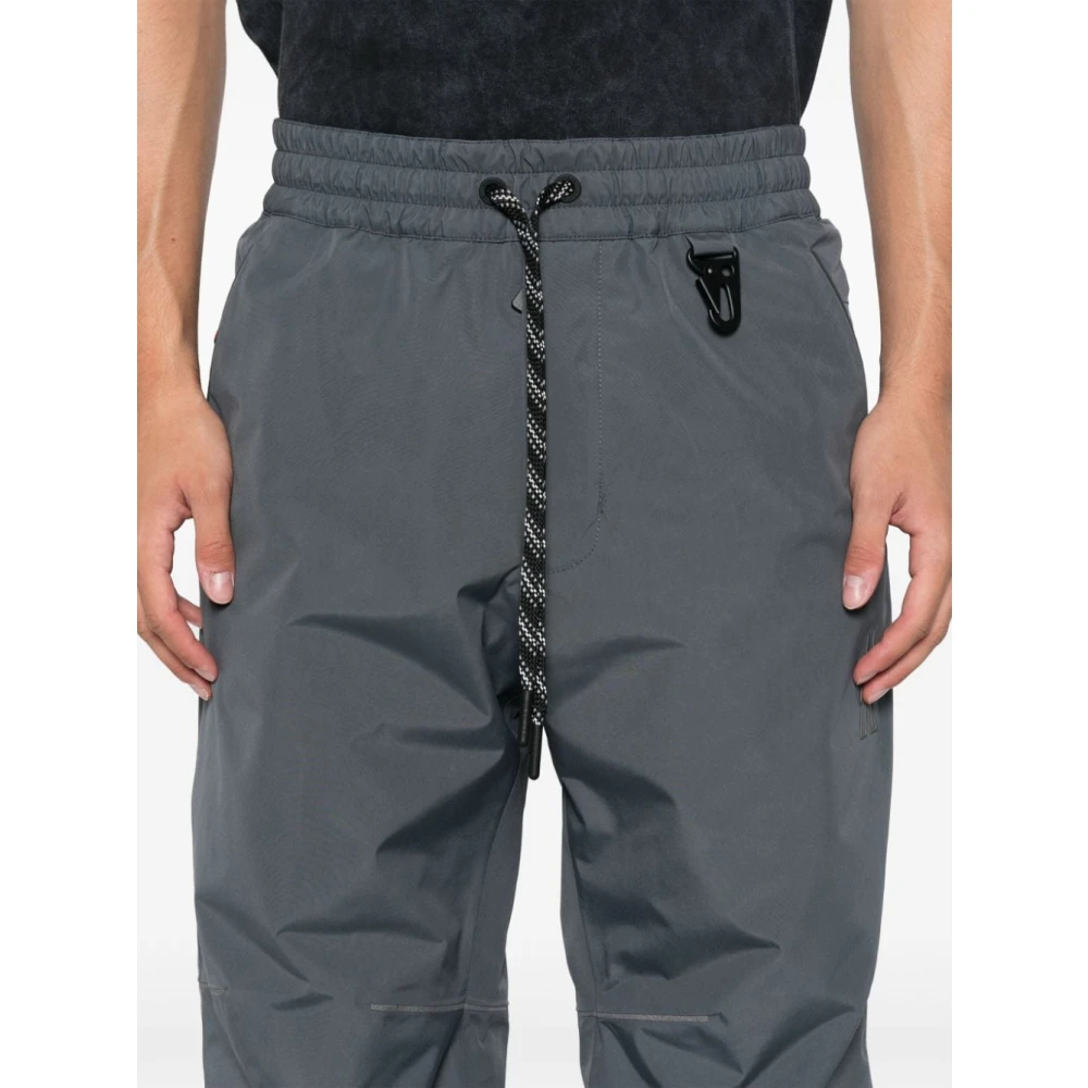 Moncler Grijze gewatteerde broek met reflecterende details Gray Heren