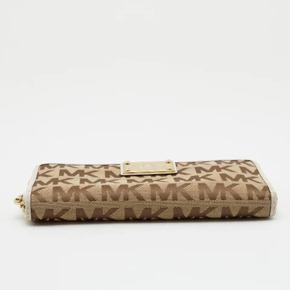 Michael Kors Pre-owned Canvas wallets Beige Dames