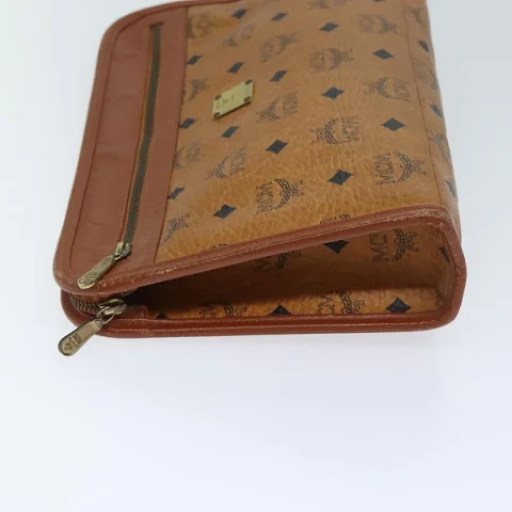 MCM Pre-owned Leather clutches Brown Dames