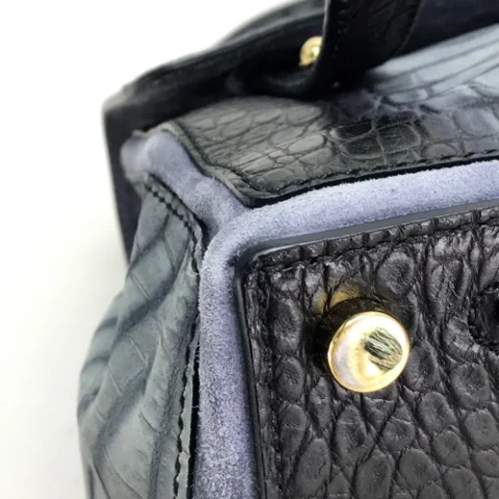 Yves Saint Laurent Vintage Pre-owned Canvas handbags Black Dames