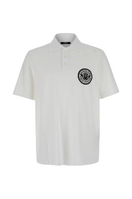 polo-blanc-avec-imprime-piece-de-monnaie
