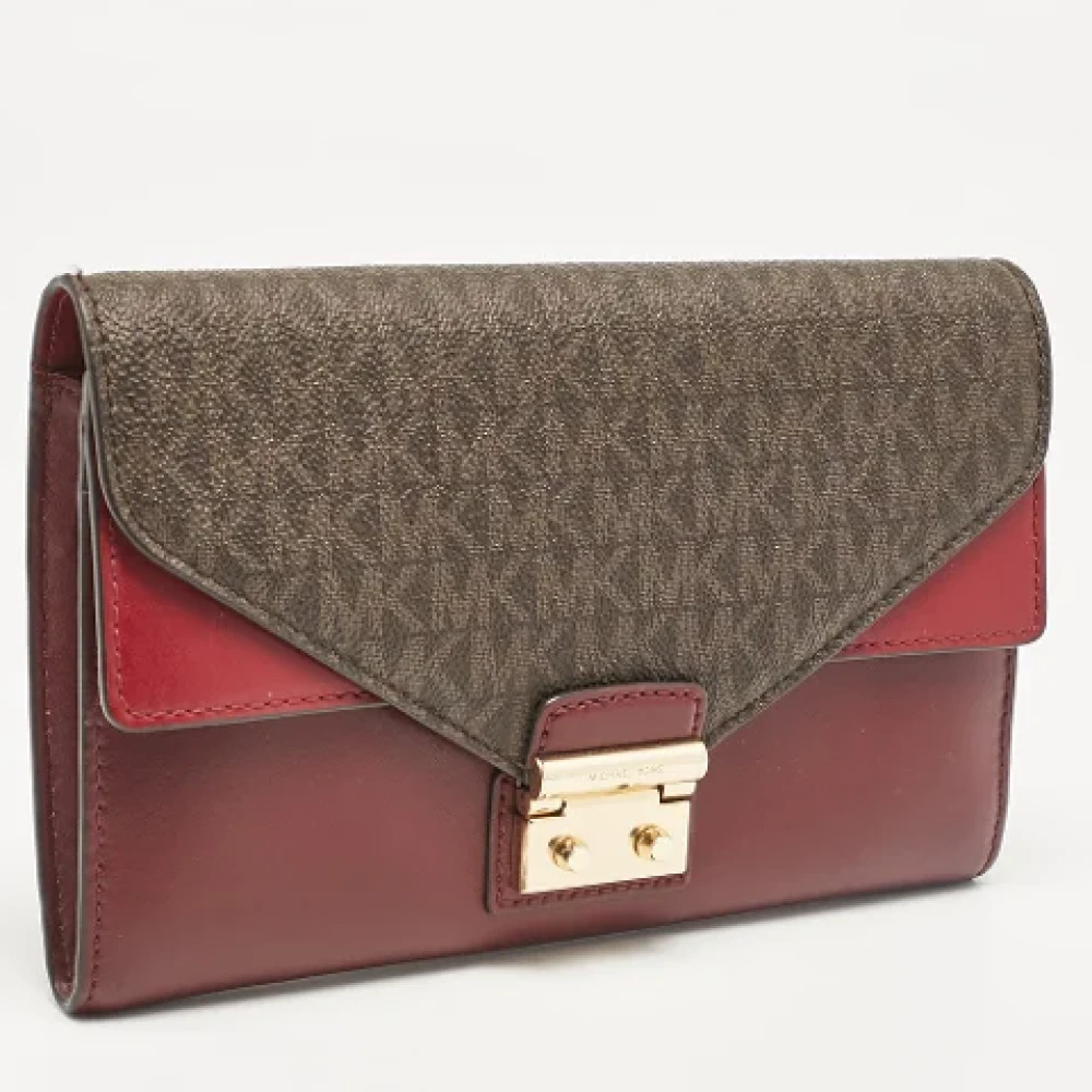 Michael Kors Pre-owned Canvas clutches Red Dames