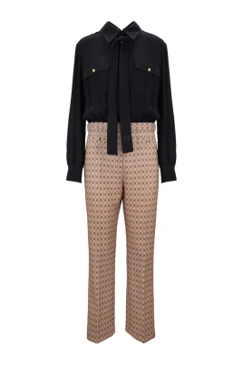 Dam jumpsuit med knapp och dragkedja